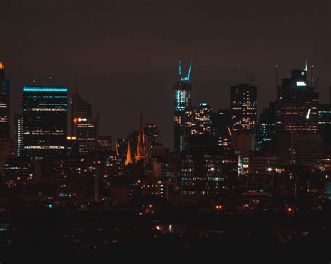 Download Wallpaper 1280x1024 Night City Buildings Aerial View Dark