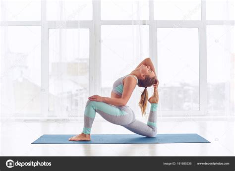 Beautiful Sporty Fit Yogi Woman Practices Yoga Asana King Pigeon Pose