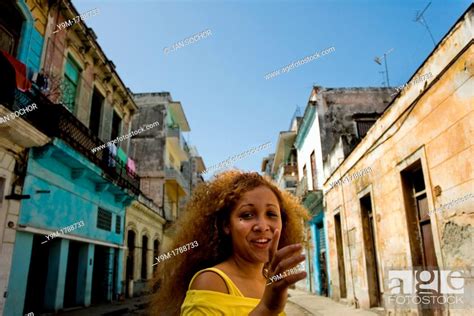 A Cuban Girl Jinetera Flirting With A Foreigner On The Street Of