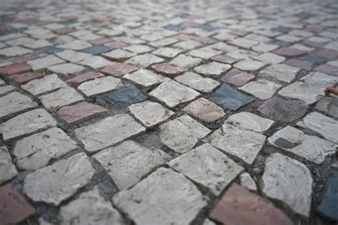 Perspective View Floating Over Cobblestone Tiles In The Cloudy Day