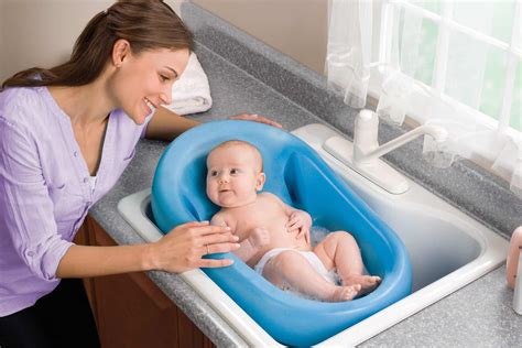 Baby Taking Bath In Sink Baby Taking A Bath In Sink Stock Photo