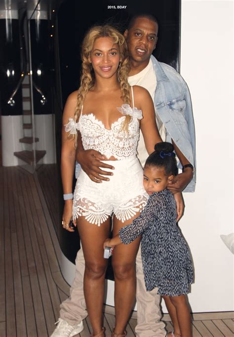The picture show a joyful beyoncé in a stunning white strapless gown (designed by her mother) — her right hand raised in triumph as she cheers towards the sky. Beyonce and Jay Z Family Pictures | POPSUGAR Celebrity ...