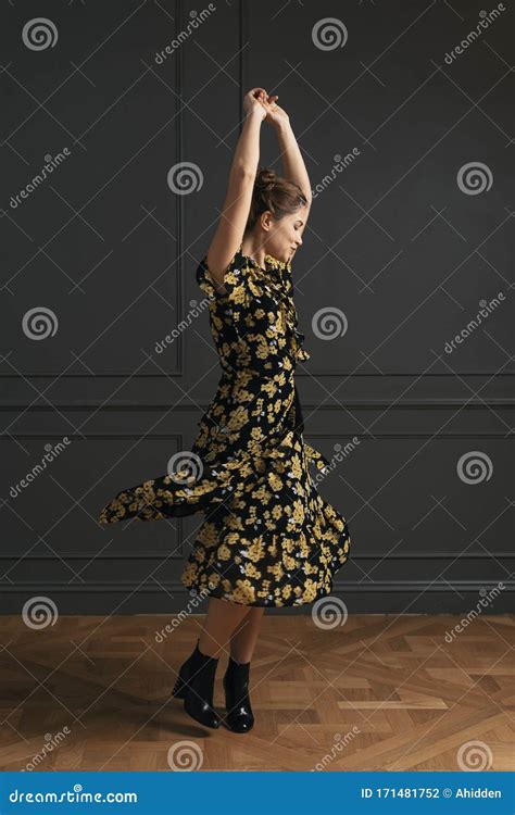 Attractive Young Woman Dancing And Posing In The Studio Stock Photo