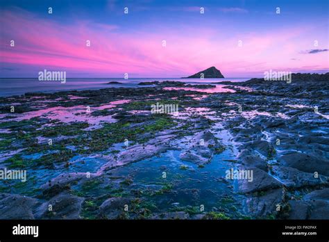 Dusk Or Dawn At Rocky Beach With Timelapse Blur Stock Photo Alamy