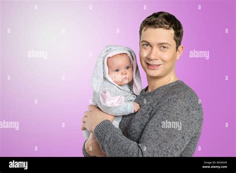 Happy Young Man Holding A Baby Stock Photo Alamy