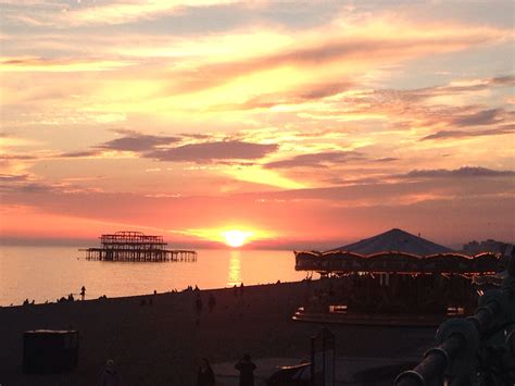 Sunset On Brighton Beach With The West Pier In The Background