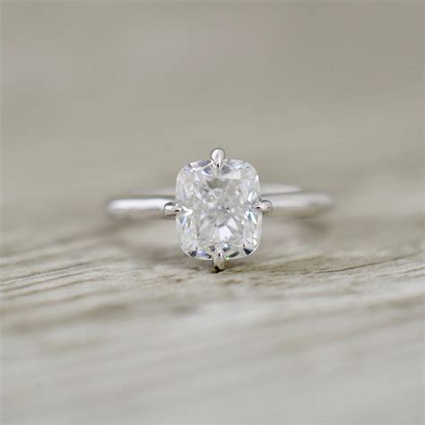 Cushion Brilliant In A Compass Point Prong Set Hidden Halo Engagement