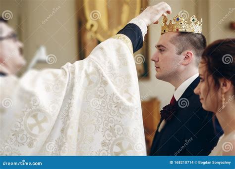 Sensual Happy Bride And Groom Wearing Gold Crowns During Wedding