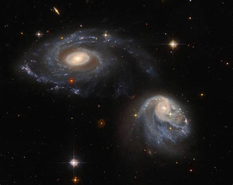 Nasas Hubble Telescope Captures Stunning View Of Two Interacting Galaxies