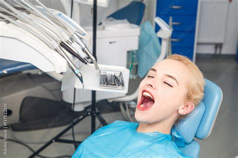 Girl With An Open Mouth Waiting For Examination At The Dentist Stock