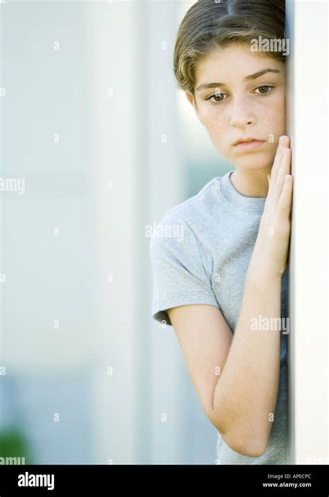 Girl Leaning Against Wall Stock Photo Alamy