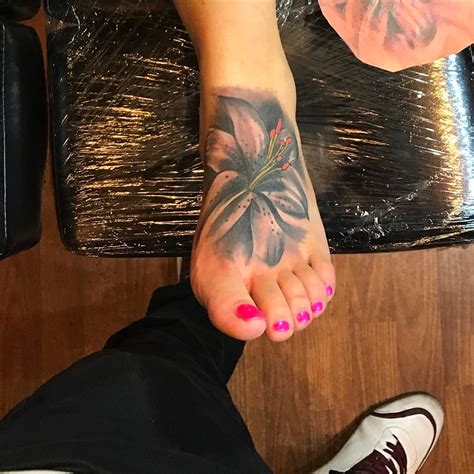 Relastic Lily Flower Tattoo On Foot Blurmark