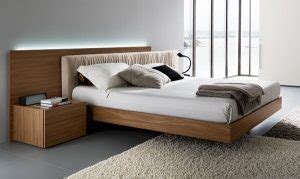 A floating bed design evokes a feeling of superiority by flowing above the floor emphasizing the feel of space allowing air to pass through the room easier. eclectic-bedroom-with-wooden-floating-bed-frame-with-white ...