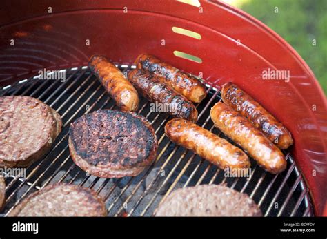 Hamburgers And Hot Dogs On The Barbecue Stock Photo Alamy