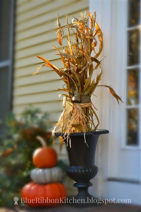 Blank black sandwich board and framed indian corn with corn stalks. Blue Ribbon Kitchen: Recycling Corn Stalks for a Harvest Door