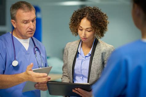 Medical Staff Meeting With Business Stock Photo Download Image Now