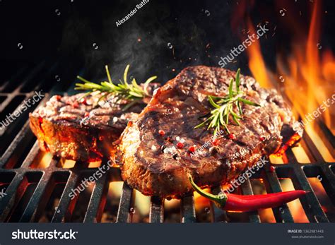 Beef Steaks Sizzling On Grill Flames Stock Photo 1362981443 | Shutterstock