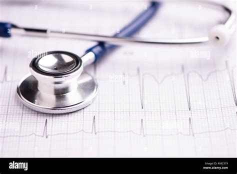 A Stethoscope On Ecg Medical Report Close Up Stock Photo Alamy