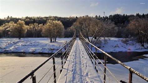 Snowy Narrow Bridge Across The Frozen River Wallpaper Nature