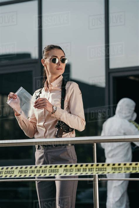 Female Detective With Evidence Package In Hands Stock Photo Dissolve