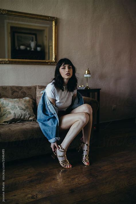 fashionable woman sitting on sofa by stocksy contributor jovana rikalo photography poses