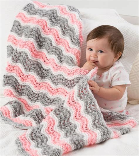 Pick from these free knitting patterns for baby blankets and make your little one smile! Baby Girl Chevron Blanket | AllFreeKnitting.com