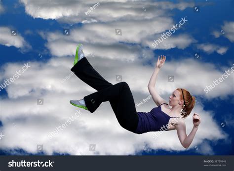 Beautiful Young Woman Falling Through Sky Stock Photo 98750348