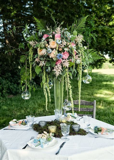 Pink Wildflower Centrepiece In Tall Glass Vase Wedding Flowers