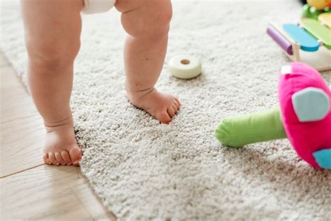 Premium Photo Closeup Of Babys Legs While Standing