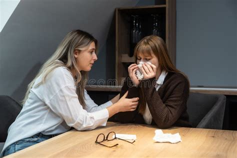 Young Friend Woman Comforting Her Sad Depressed Colleague In Office Who