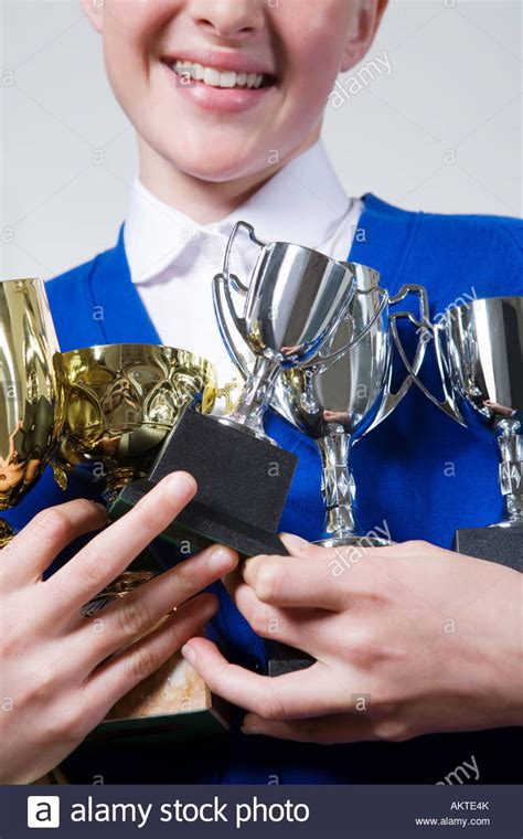 Girl Holding Trophies Stock Photo Royalty Free Image 15070098 Alamy