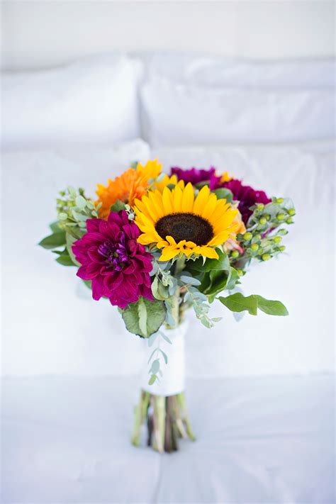 Our wedding flowers include such flowers as roses, daisies, chrysanthemums and many others and look fantastic. Magenta Dahlia, Sunflower and Gerbera Daisy Bridal Bouquet
