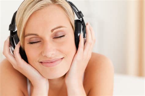 Premium Photo Close Up Of A Delighted Woman Wearing Headphones