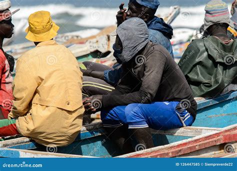 Unidentified Senegalese Man Sits On The Boat On The Coast Of Th