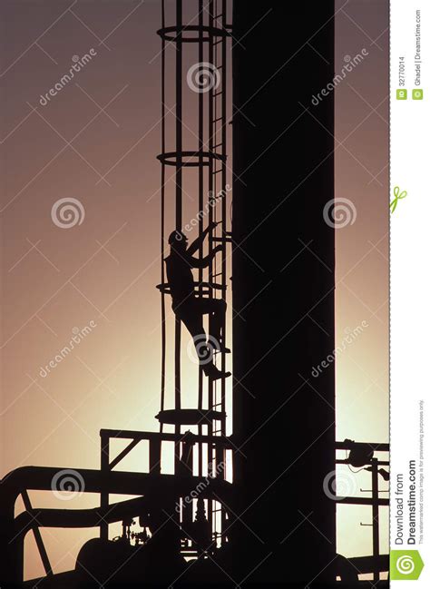 Man Climbing Ladder At Gas Refinery Stock Photo Image Of Sunburst