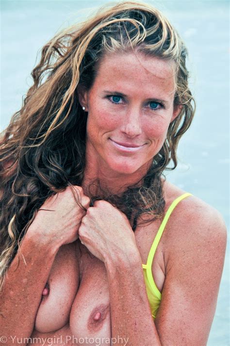 Sultry MILF Sofie Marie Poses In Her Sheer Yellow Bikini In The Sea NakedPics