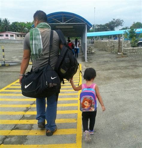 Filipina Mom Secretly Takes Pictures Of Husband And Daughter Holding