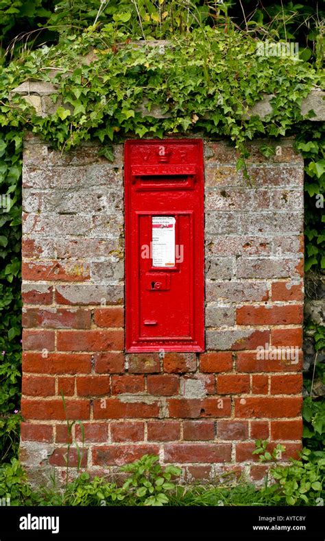 Victorian British Red Post Box Set In A Brick Wall At Tunstead Norfolk