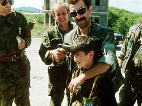 Serb soldiers pose with a boy, outskirts of Sarajevo ...
