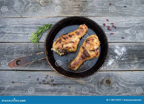 Grilled Chicken Legs With Spices And Herbs On Apan On A Wooden B Stock