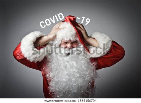 Frustrated Santa Claus Suffering Headache Concept Stock Photo