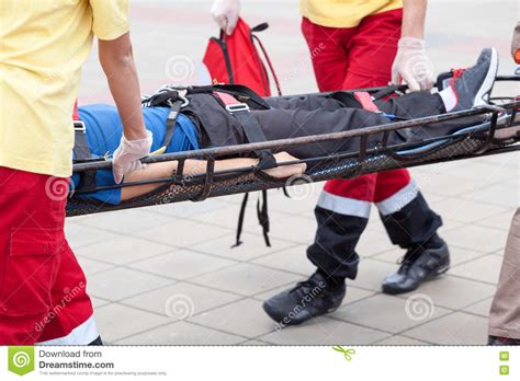 Paramedics Evacuate An Injured Person Stock Image - Image of glove, medical: 82245003