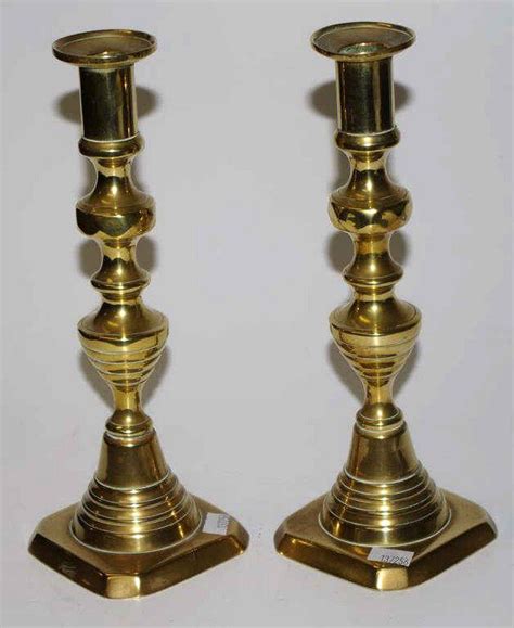Antique pair brass candlesticks each with candle ejector… - Candelabra/Candlesticks - Lighting
