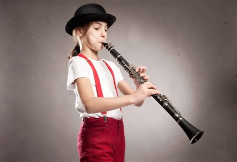 Premium Photo Little Girl Playing Clarinet