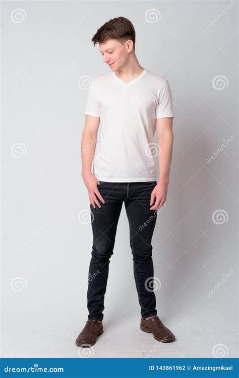 Full Body Shot Of Young Handsome Man Looking Down Stock Photo Image