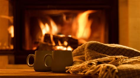 Steam From A Cups With A Hot Cocoa On The Fireplace Background