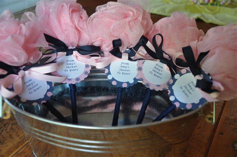 By the way, don't forget to check out this awesome article on how to throw a baby shower on a budget for some cool inexpensive party ideas. Nautical Pink and Navy Unique Baby Shower Favor Bath Puff Baby