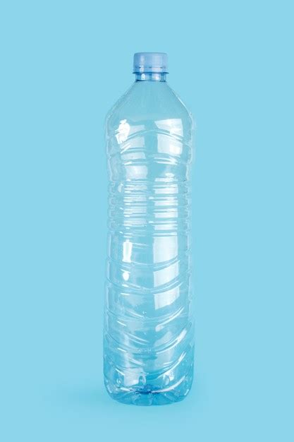 Premium Photo Empty Plastic Water Bottle On A Blue Background