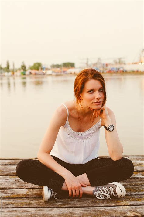 Casual Woman Sitting On The Dock By Stocksy Contributor Alexandra Bergam Stocksy