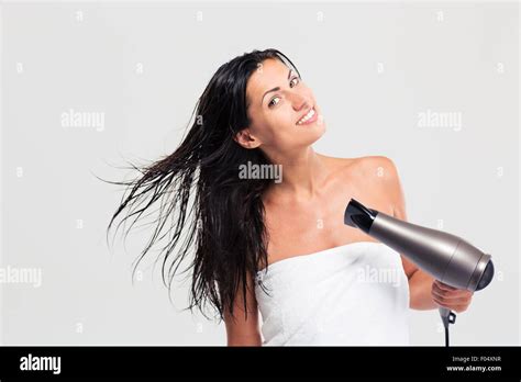 Pretty Young Woman In Towel Drying Her Hair Isolated On A White